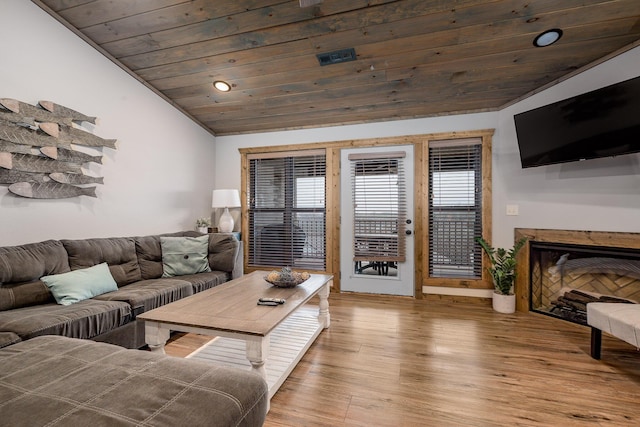 living room with recessed lighting, lofted ceiling, light wood-style floors, and wood ceiling