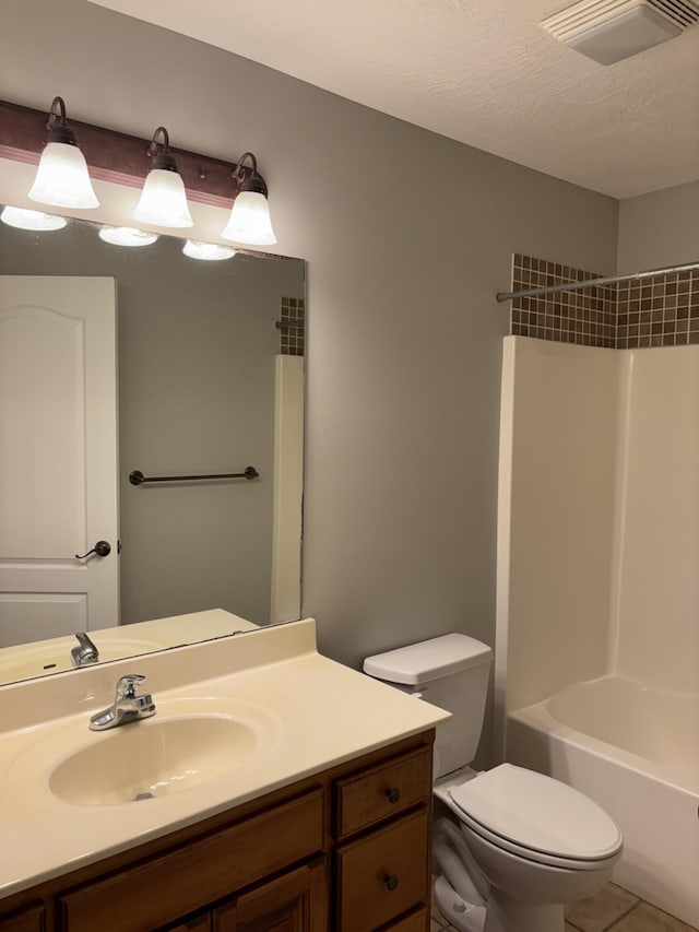 full bathroom with shower / bathtub combination, visible vents, toilet, vanity, and a textured ceiling