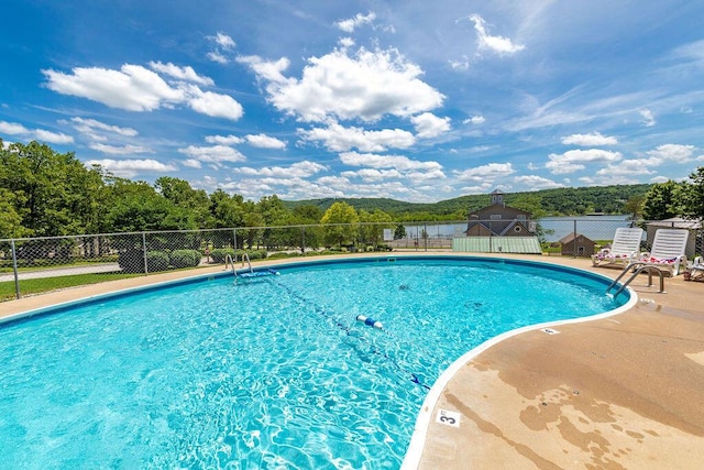 community pool featuring fence