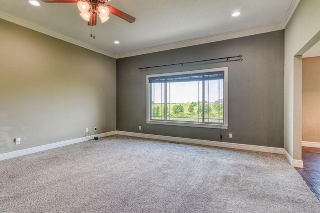 empty room featuring ornamental molding, recessed lighting, and baseboards