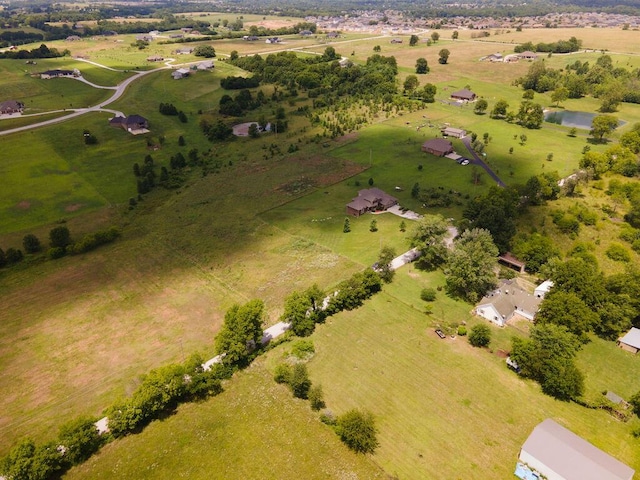 birds eye view of property featuring a rural view