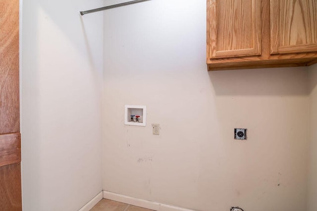 washroom with hookup for a washing machine, cabinet space, and electric dryer hookup