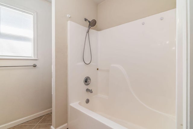 full bathroom with baseboards, tub / shower combination, and tile patterned floors