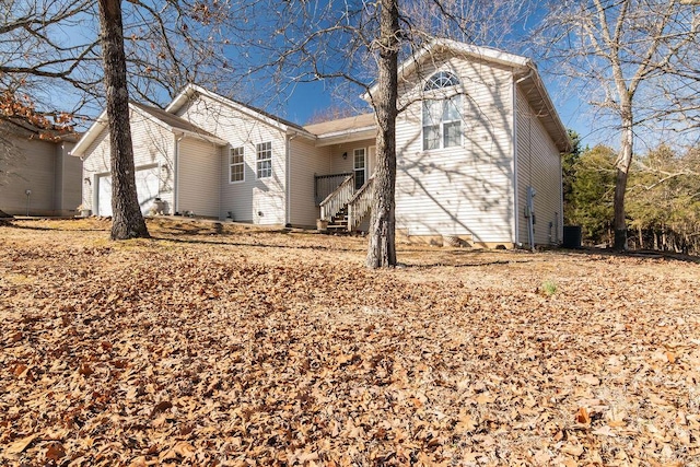 view of front of property with stairway and an attached garage