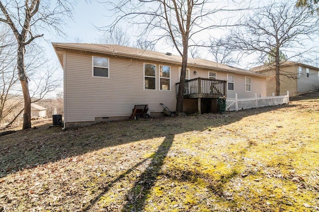 back of house with crawl space, fence, central AC unit, and a yard