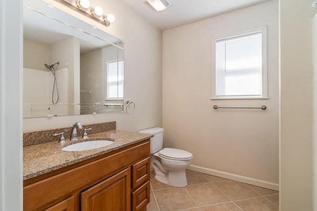 full bath featuring a shower, toilet, vanity, tile patterned flooring, and baseboards