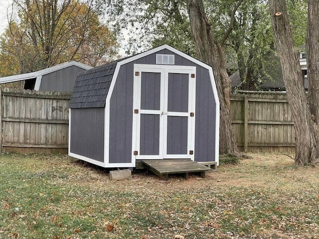 view of shed with fence