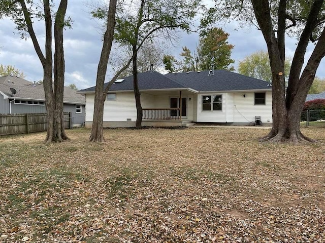 rear view of house with fence