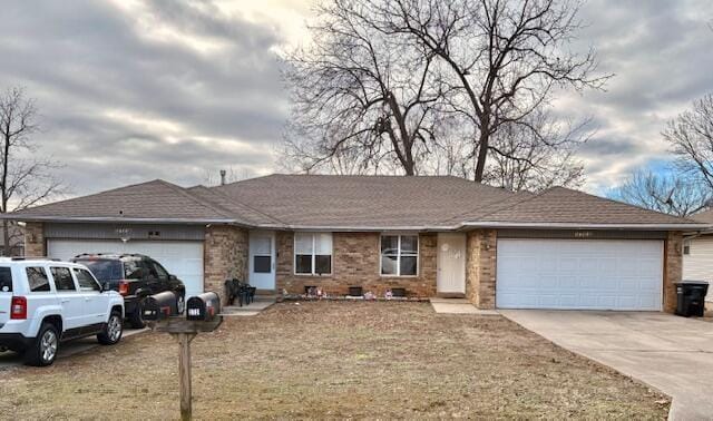 ranch-style home with concrete driveway, an attached garage, and a shingled roof