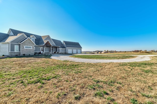 exterior space featuring a garage and a front lawn