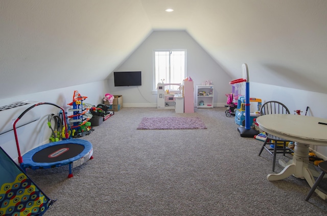 rec room with carpet, baseboards, and vaulted ceiling