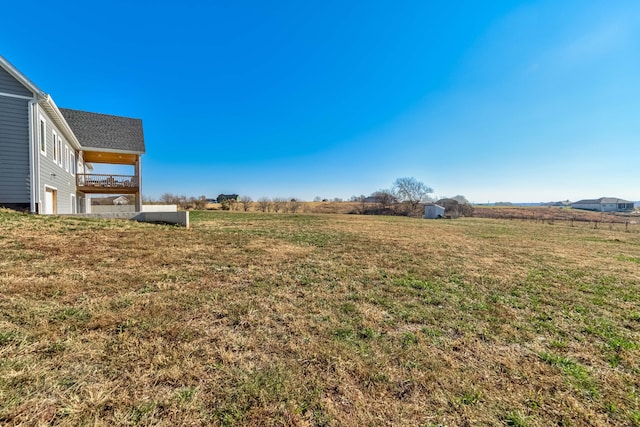 view of yard with a rural view