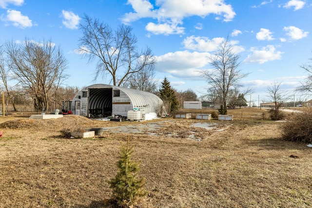 view of yard with an outbuilding and a detached carport