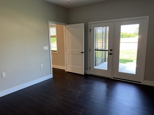 doorway to outside featuring french doors, baseboards, plenty of natural light, and dark wood-style flooring