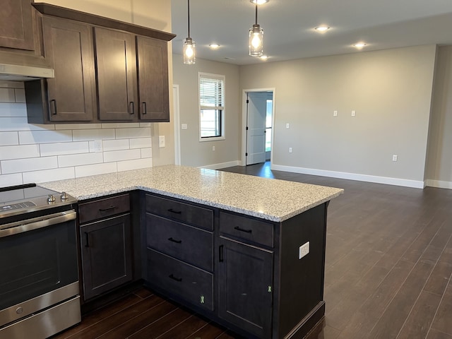 kitchen with light stone counters, stainless steel range with electric cooktop, dark brown cabinetry, and a peninsula