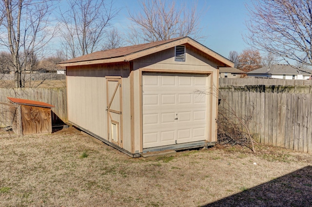 garage with fence