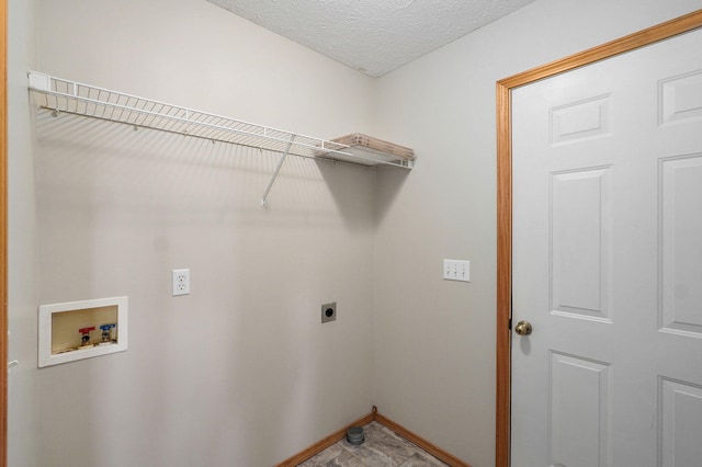 laundry room with washer hookup, electric dryer hookup, a textured ceiling, laundry area, and baseboards