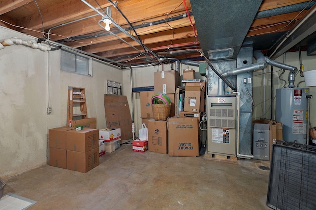 storage area featuring heating unit and gas water heater