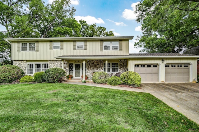 view of front facade featuring stone siding, a front lawn, an attached garage, and driveway