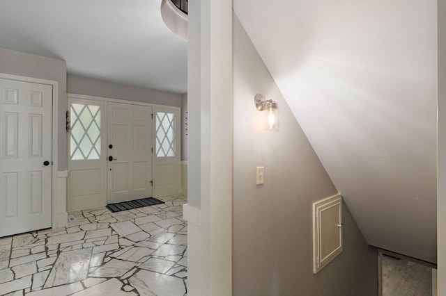 entryway featuring marble finish floor