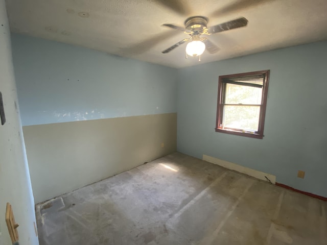 spare room featuring a ceiling fan