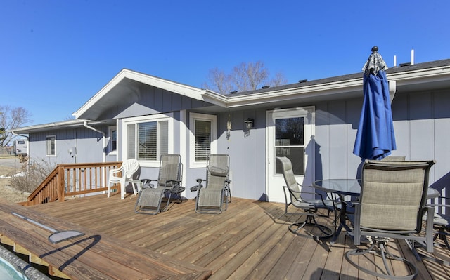 wooden deck with outdoor dining area