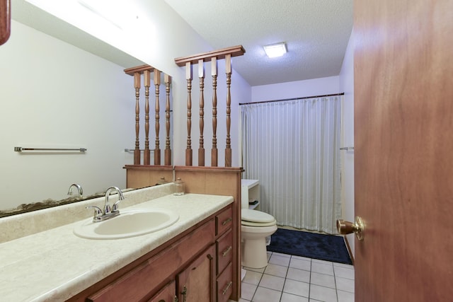 bathroom with toilet, a shower with curtain, tile patterned floors, a textured ceiling, and vanity