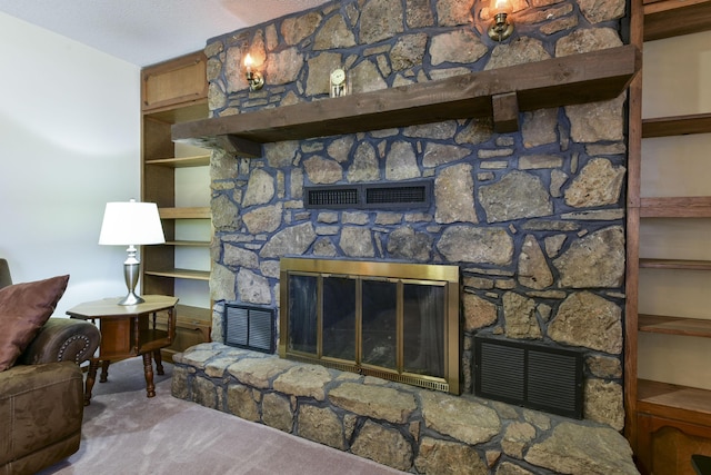 living room featuring light carpet, a fireplace, and visible vents