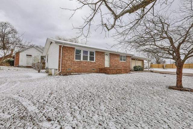 ranch-style house featuring crawl space, brick siding, fence, and an attached garage