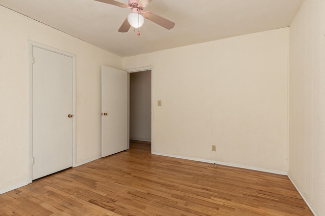 unfurnished bedroom featuring light wood-type flooring and ceiling fan