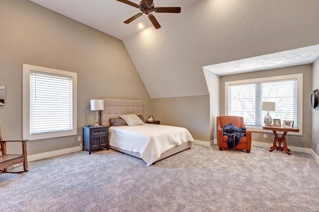 bedroom featuring lofted ceiling, carpet flooring, baseboards, and ceiling fan