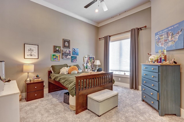 bedroom featuring a ceiling fan, crown molding, carpet, and baseboards