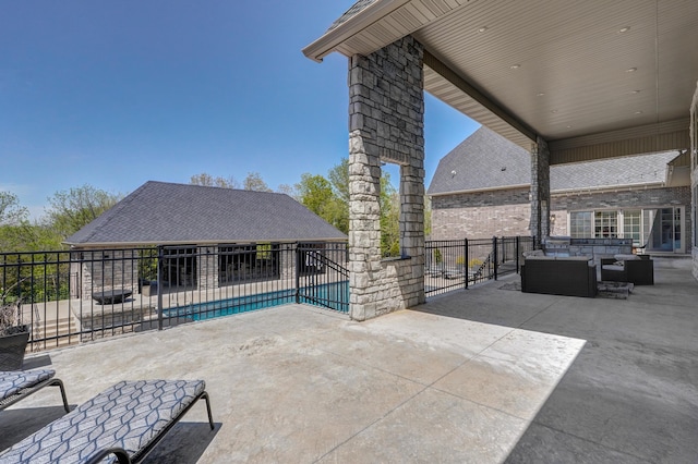 view of patio / terrace featuring outdoor lounge area, fence, and a fenced in pool