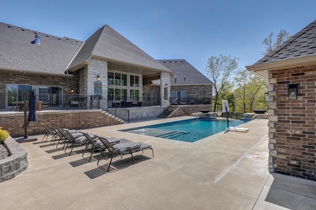 view of swimming pool with a patio area, stairway, a fenced in pool, and fence