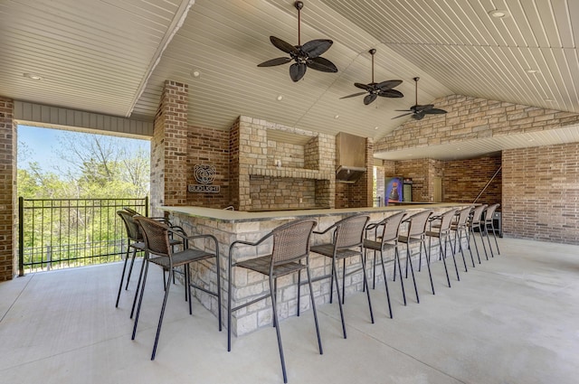 view of patio with an outdoor bar and ceiling fan