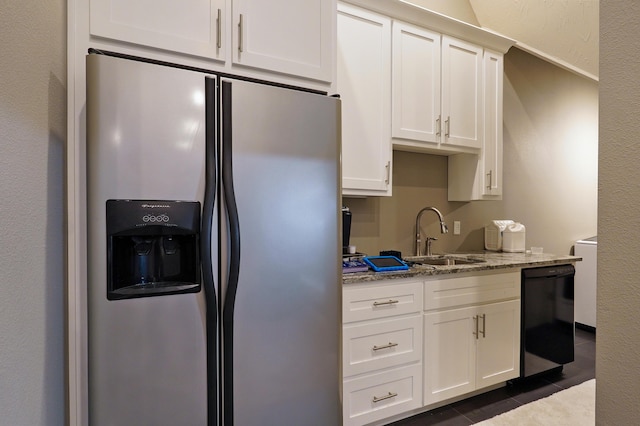 kitchen featuring light stone counters, a sink, white cabinets, black dishwasher, and stainless steel refrigerator with ice dispenser