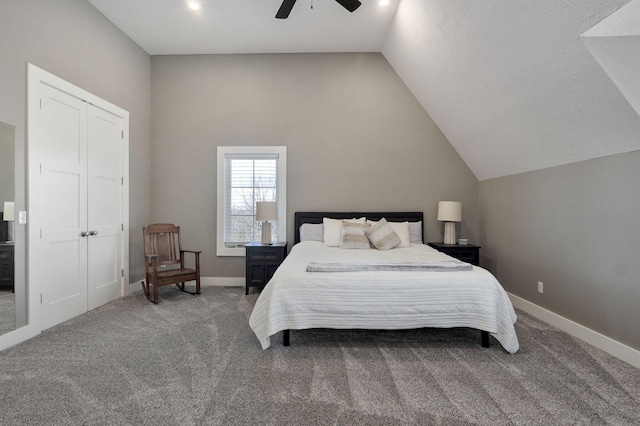 carpeted bedroom with lofted ceiling, baseboards, and ceiling fan