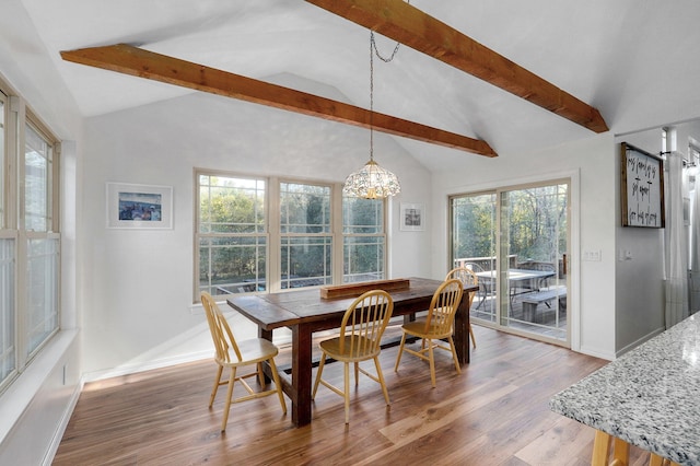 dining area with baseboards, light wood-style flooring, lofted ceiling with beams, and an inviting chandelier