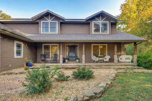 view of front facade featuring a porch and a shingled roof