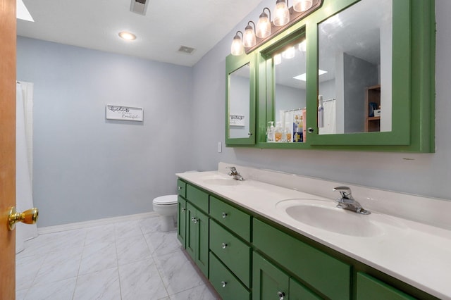 full bathroom featuring toilet, marble finish floor, a sink, and visible vents