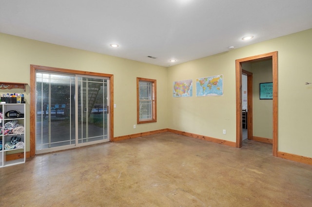 spare room featuring recessed lighting, visible vents, and baseboards