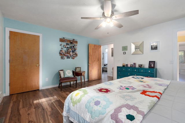 bedroom with ceiling fan, visible vents, baseboards, and dark wood-type flooring