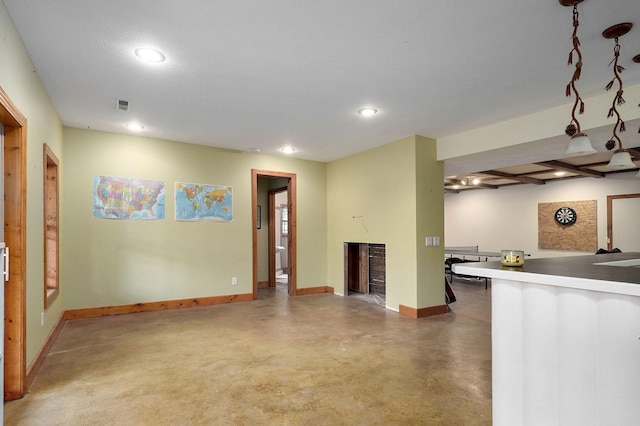 interior space with concrete flooring, recessed lighting, visible vents, baseboards, and light countertops