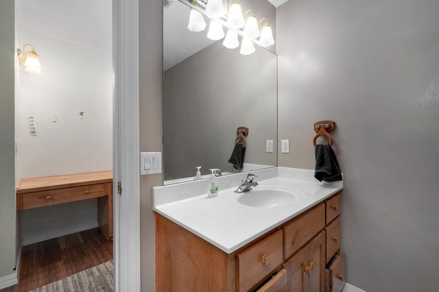 bathroom featuring wood finished floors and vanity