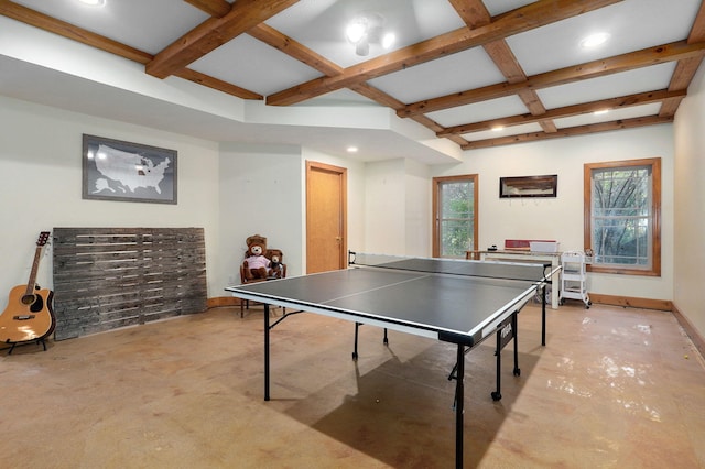 playroom featuring concrete flooring, a wealth of natural light, coffered ceiling, and baseboards