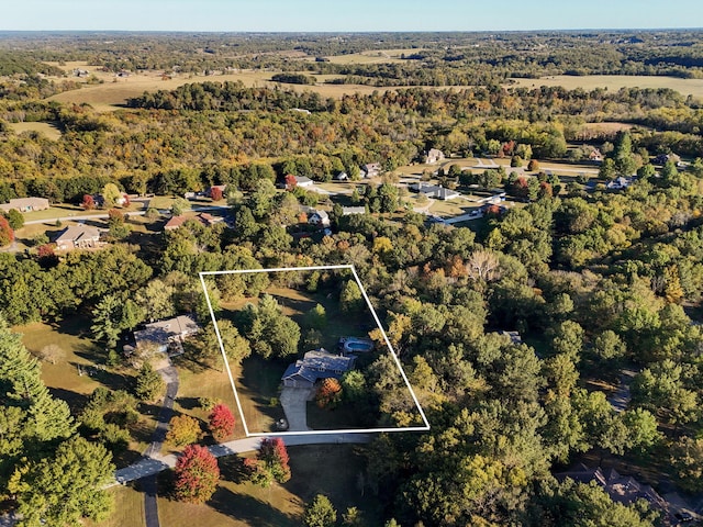 bird's eye view featuring a forest view