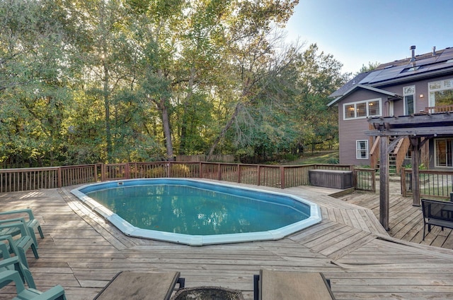 view of swimming pool featuring a fenced in pool and a wooden deck