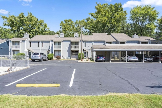 158 River Point Rd Unit 15, Hollister, MO 65672 - view of building exterior with uncovered parking and a residential view