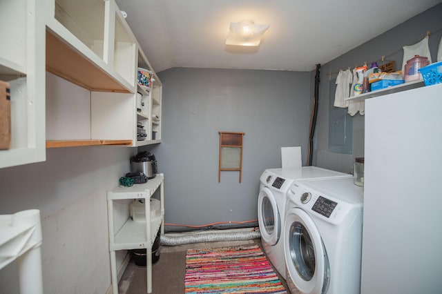 laundry room with washer and clothes dryer and cabinet space