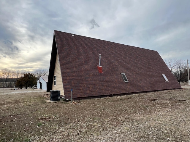 view of property exterior with central AC